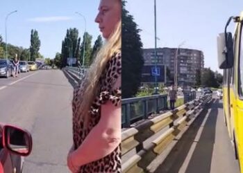 Подружжя волонтерки та військового зупиняють рух на транспортному мосту в Ужгороді на хвилину мовчання (ВІДЕО)